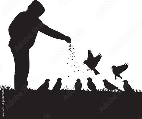 Silhouette of person feeding birds in winter landscape