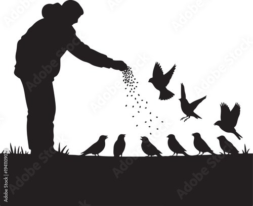 Silhouette of person feeding birds in winter landscape