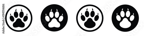 Four oval shaped animal paw prints in black and white
