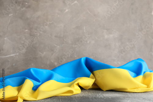 Flag of Ukraine on grey gru...
