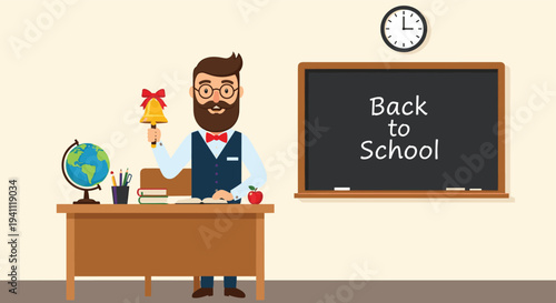 Bearded male teacher sitting at his desk holding a school bell with a blackboard and globe in the background.