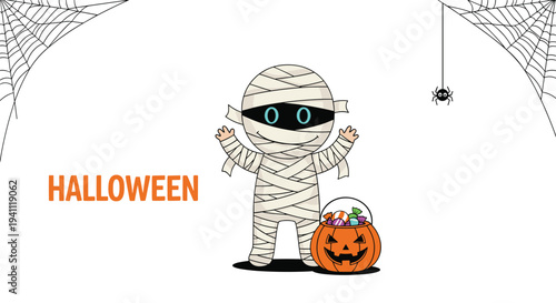 Cute mummy character for halloween standing next to a carved pumpkin bucket full of colorful candies and treats.