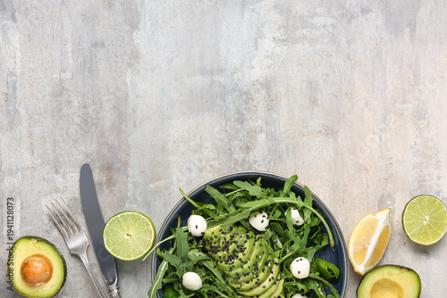 Bowl with tasty arugula sal...