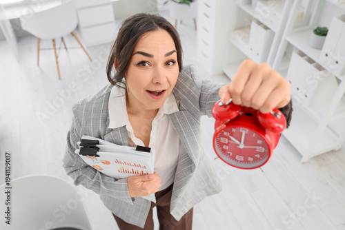 Shocked businesswoman with ...