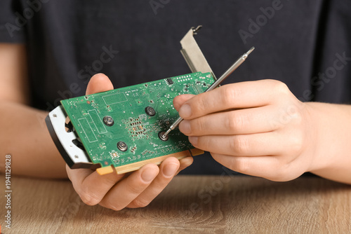Young woman dismantling vid...