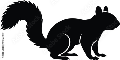 Black silhouette of a squirrel standing on its hind legs side view