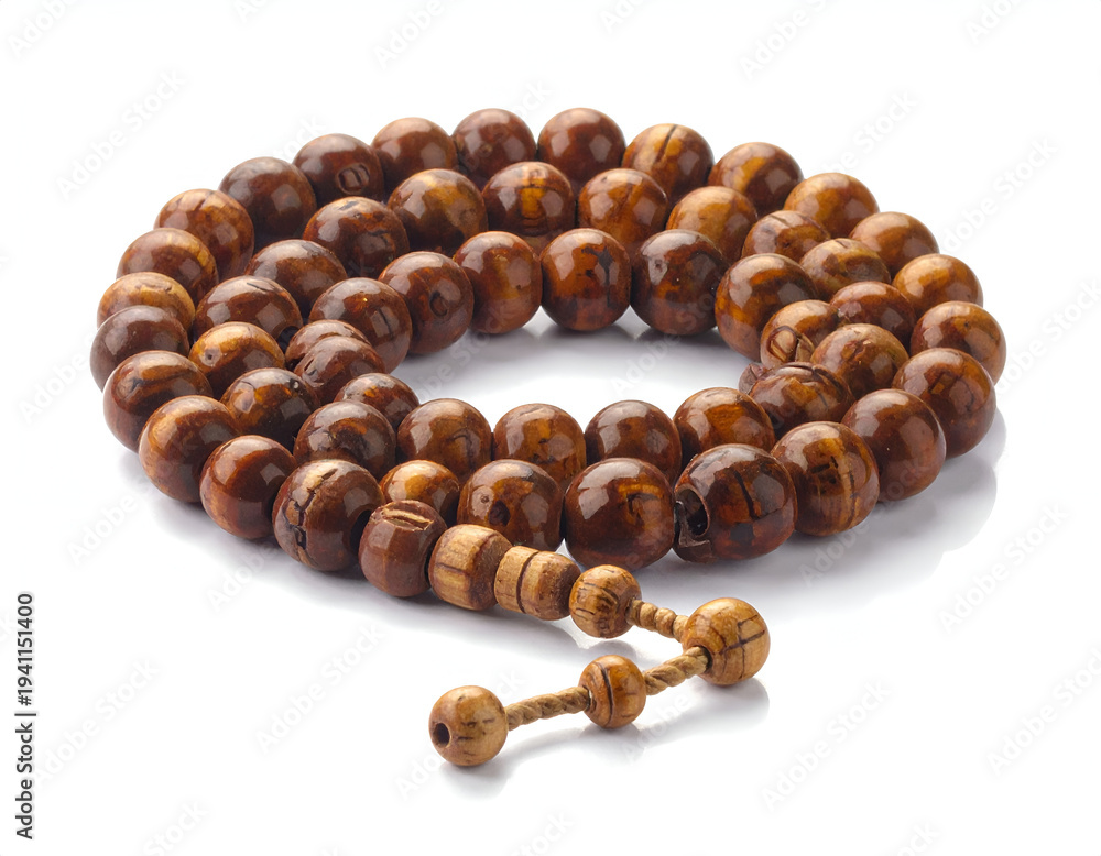 Obraz premium Round, polished wooden prayer beads arranged in a circular pattern