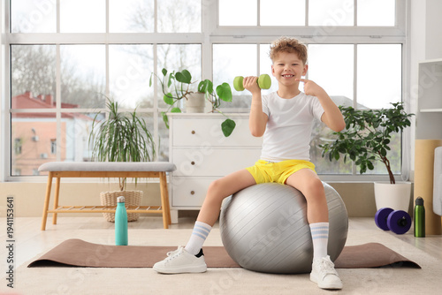 Sporty little boy on fitbal...