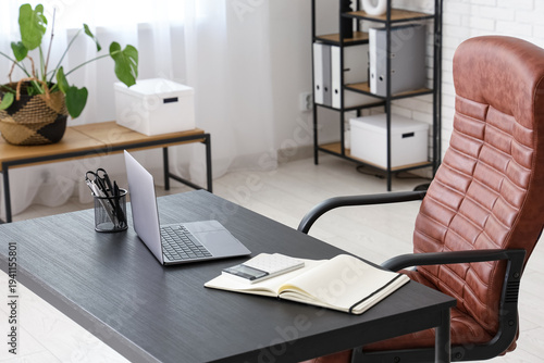 Workplace with laptop and c...