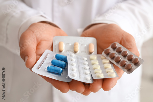 Male doctor with pills in c...