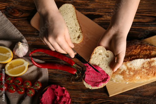 Woman spreading tasty beetr...