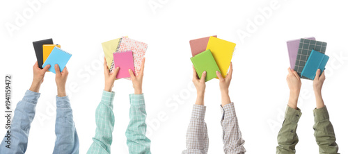 Many hands with notebooks o...