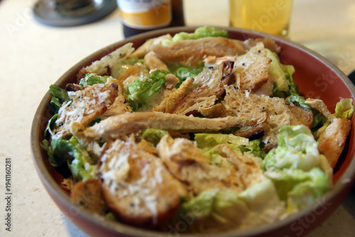 Classic Caesar salad on a plate in a Thai restaurant