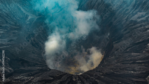 Fényképezés Overhead view into the steaming crater of Mount Bromo, East Java