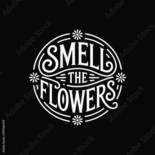 A circular design spells out smell the flowers with floral accents