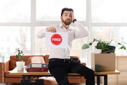 Shocked young man holding p...