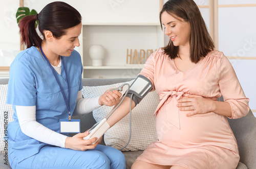 Female doctor measuring blo...