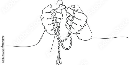 Hands holding prayer beads in contemplative moment