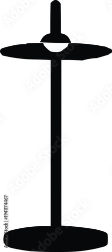 The image depicts a black floor lamp set against a clean white background, emphasizing its design. The lamp features a rounded base, which provides stability and support. The long, narrow pole extends