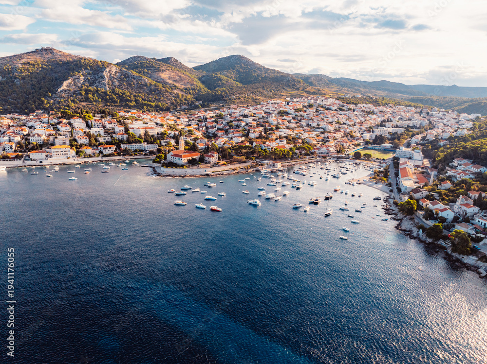 Fototapeta premium Aerial view of the historic Hvar town and the Spanish Fortress (Fortica) overlooking the harbor and Adriatic sea, Hvar island, Dalmatia, Croatia.