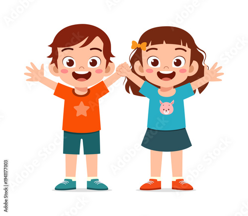 Happy young Asian boy and girl standing together holding hands raising arms with big smiles full of joy