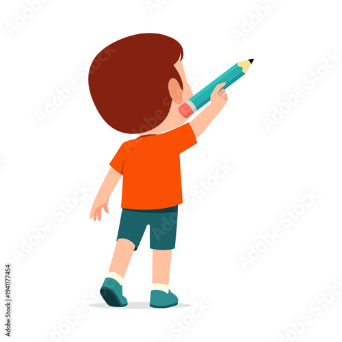 Cute young boy viewed from back actively drawing with a large blue pencil feeling creative and happy