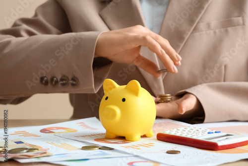 Piggy bank on table against...