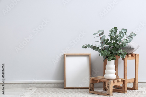 Vase with eucalyptus twigs,...