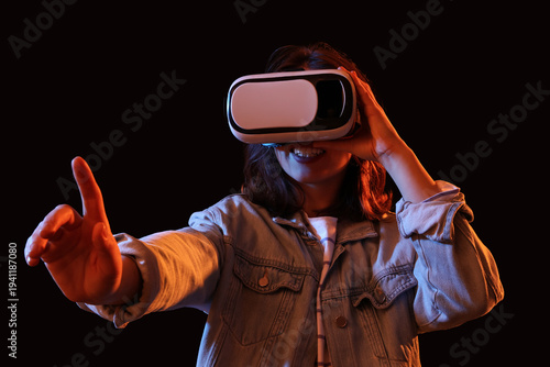 Young woman using VR glasse...