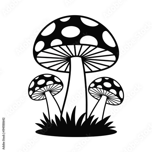 Black and white silhouette of spotted mushrooms growing in grass retro