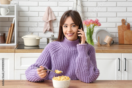 Young woman eating tasty co...