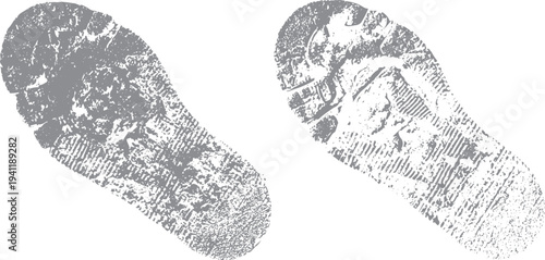 Two grey distressed shoe sole prints on white background