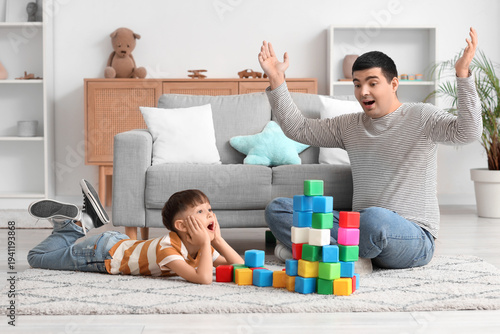 Shocked father and his litt...