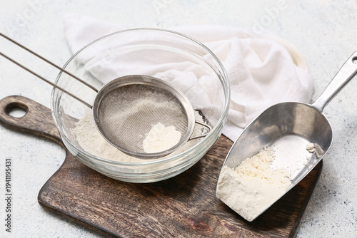 Bowl with flour, metal siev...