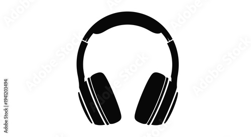 Black silhouette of over ear headphones against a white background