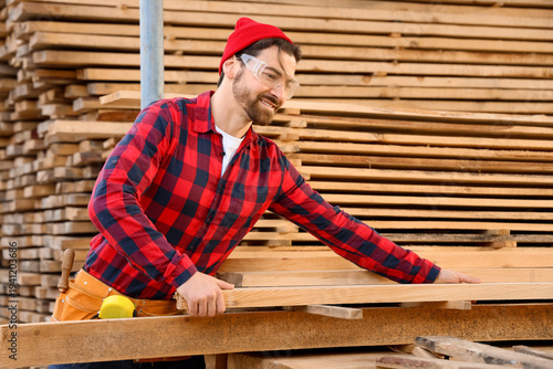 Male carpenter with wooden ...