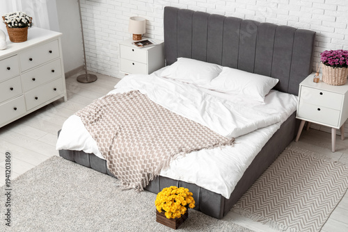 Interior of bedroom with ta...