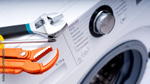 Photos Washing machine repair tool on washing machine