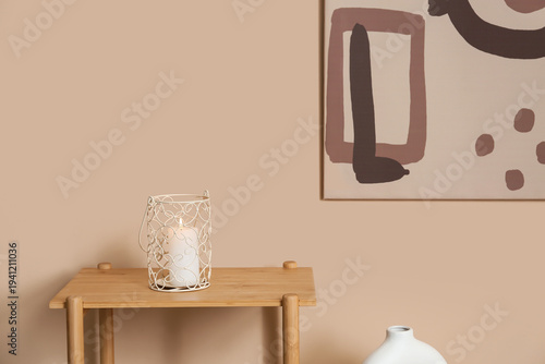 Stylish candle on shelving ...