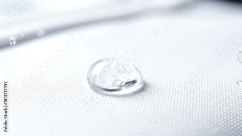 Water Droplets Falling on White Surface Slow Motion.