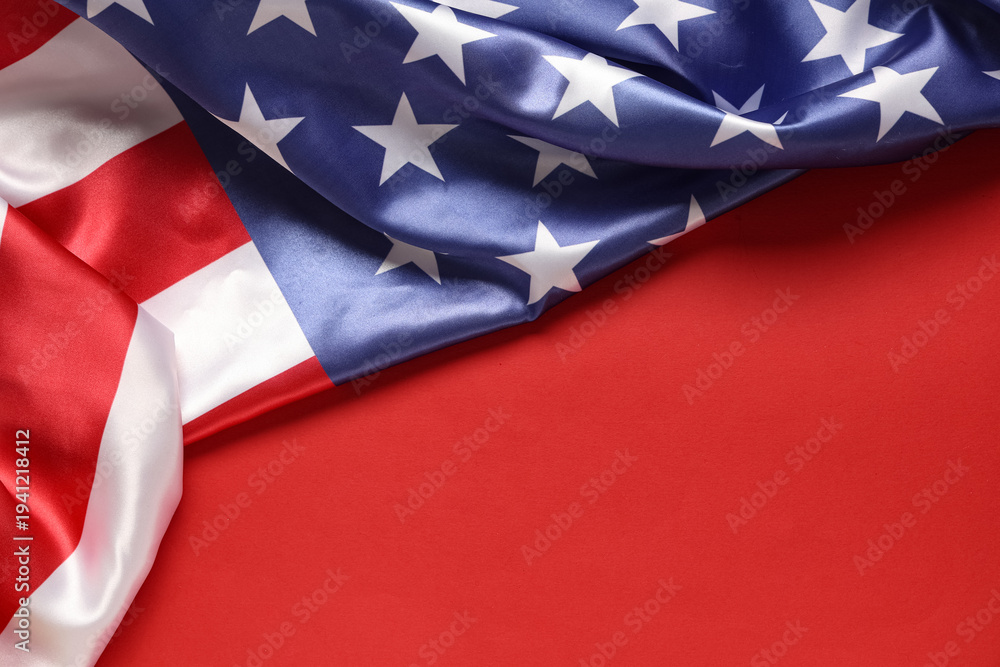 Fototapeta premium Flag of USA on red background, closeup. Memorial Day celebration