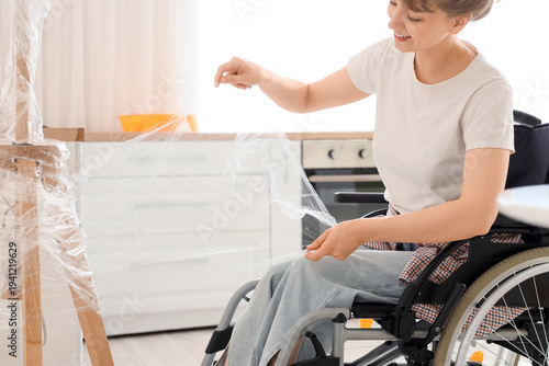 Young woman in wheelchair w...