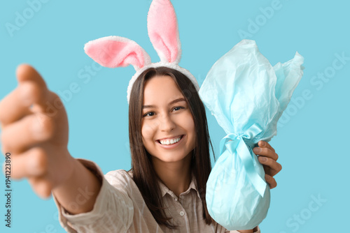 Pretty young woman with bun...