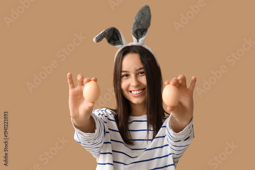 Pretty young woman with bun...