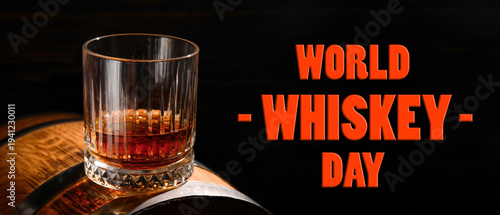 Barrel with glass of rum on...