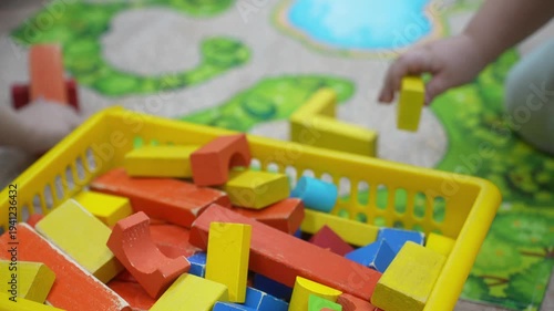 Wallpaper Mural The child plays as a wooden constructor. Selective focus. Kid Torontodigital.ca