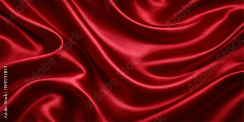 Luxurious red silk and satin fabric background featuring smooth flowing waves and elegant drapery texture for a shiny soft textile backdrop