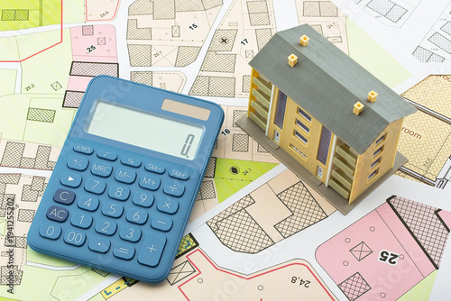 Imaginary cadastral map and general urban plan with cadastral parcels, urban destinations, vacant land plots and condominium residential building