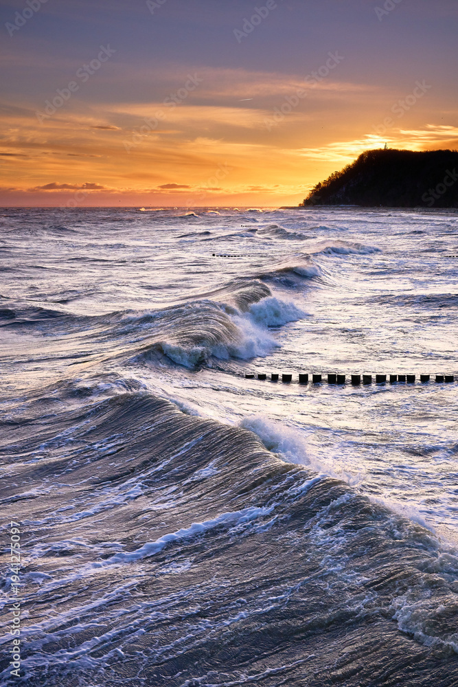 Fototapeta premium Dramatic Winter Storm Waves at Koserow Beach Sunrise