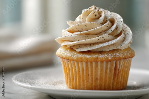 Close-up of a premium vanilla cupcake with smooth frosting and delicate sugar dusting